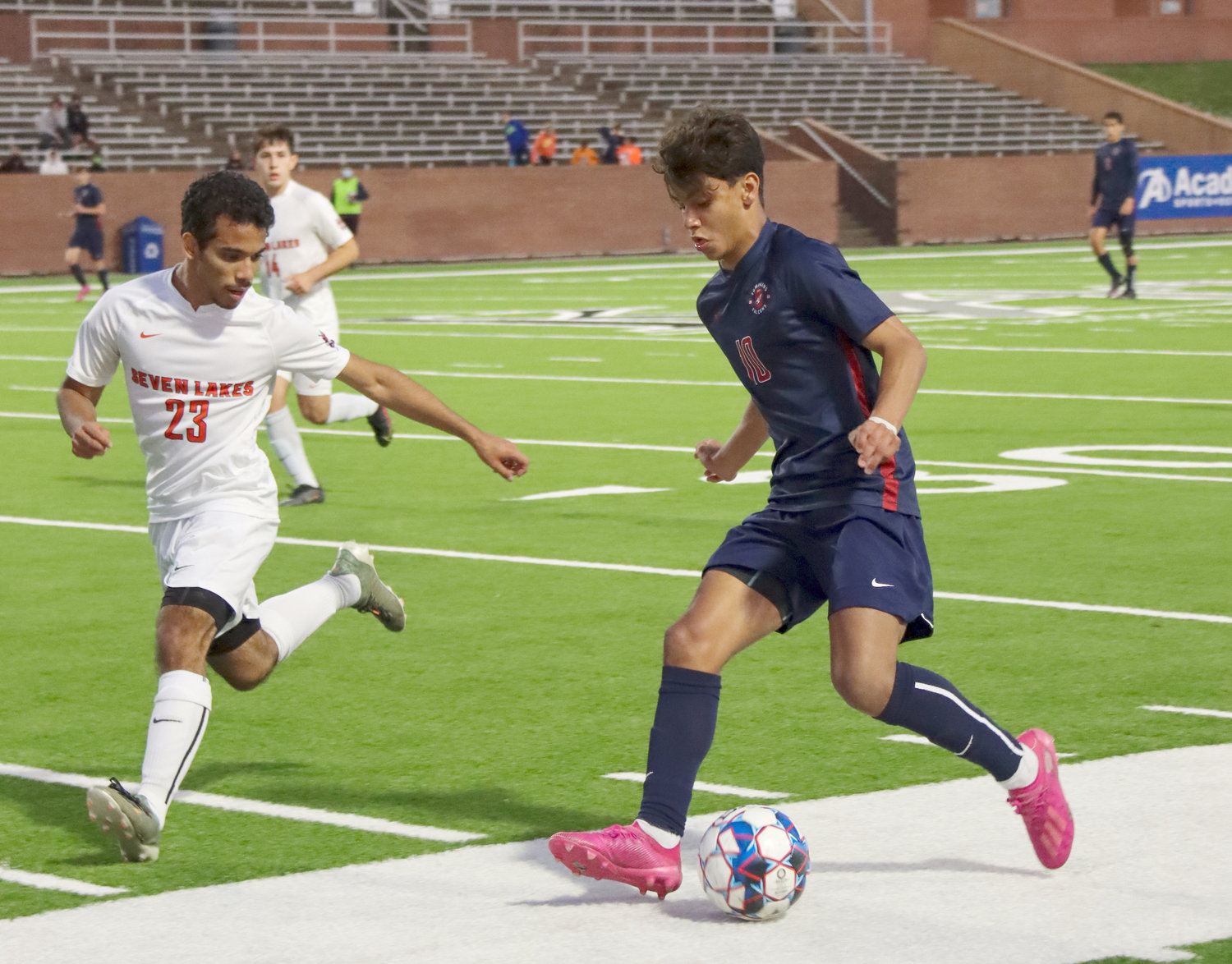 Tompkins sophomore Luis Lugo (10) takes on a Seven Lakes defender during their Class 6A regional quarterfinal game Friday, April 2, at Rhodes Stadium.